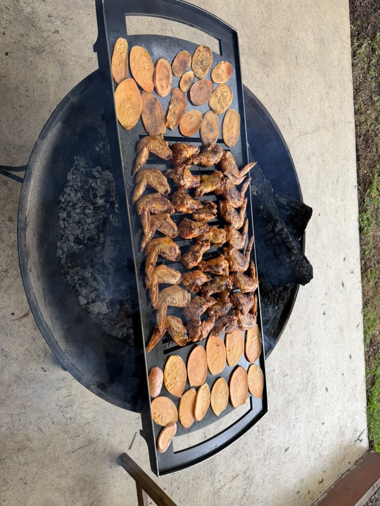 Chicken wings over the fire.