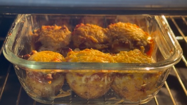 Opening, filling, baking and serving the potatoes.