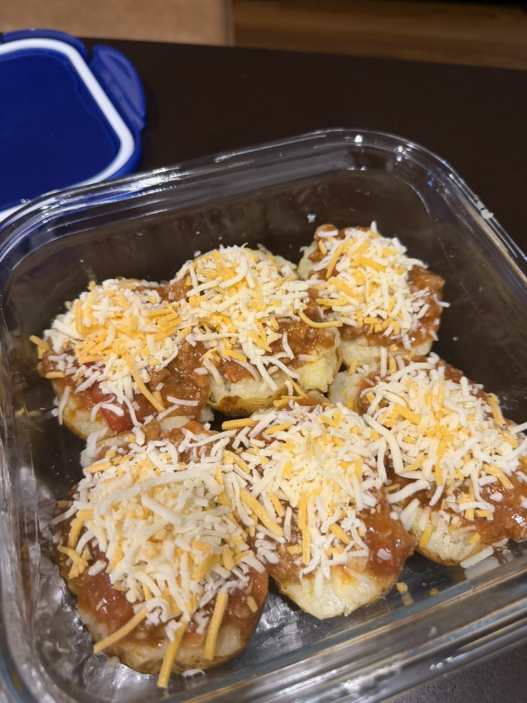 Opening, filling, baking and serving the potatoes.
