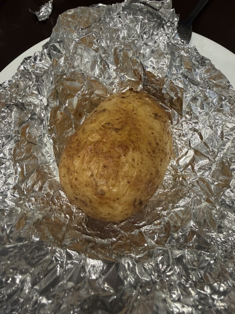 Opening, filling, baking and serving the potatoes.