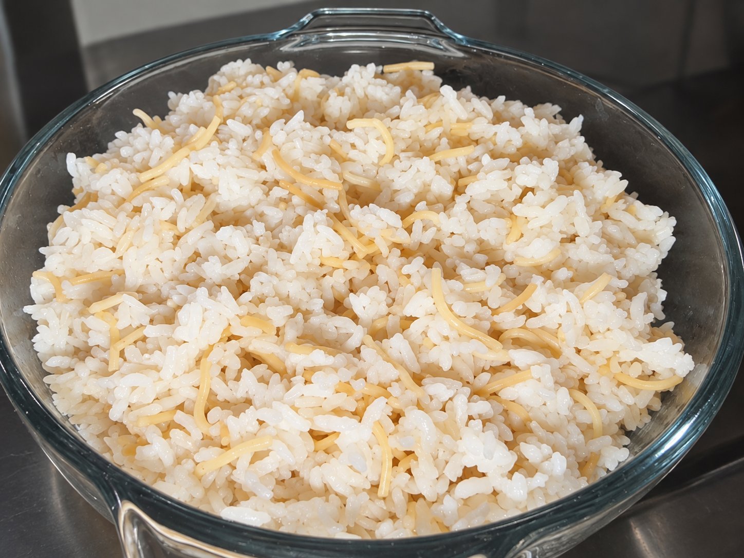 Lebanese rice with vermicelli in a glass serving bowl.